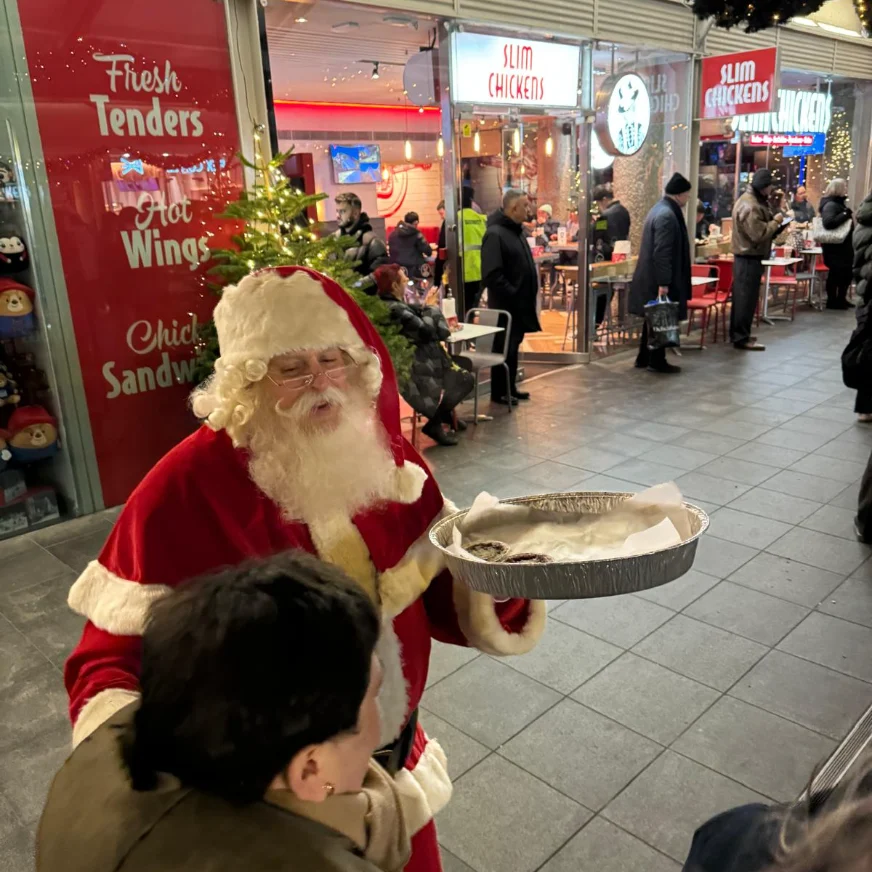Father Christmas handing out treats at Brunswick Centre