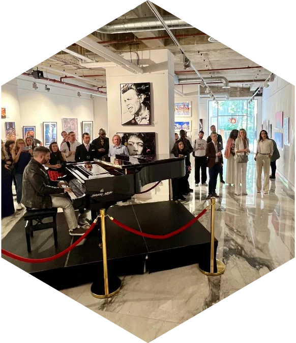 Pianist performing at an event in a Lazari building